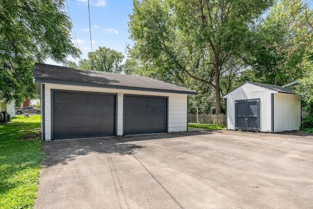 619 4th Ave E, Shakopee, MN 55379 - detached garage featuring a shed