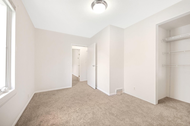 619 4th Ave E, Shakopee, MN 55379 - unfurnished bedroom featuring carpet floors and a closet