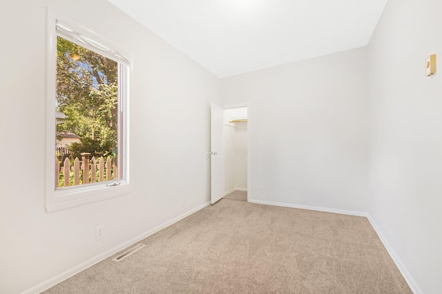 619 4th Ave E, Shakopee, MN 55379 - unfurnished room with light colored carpet and baseboards