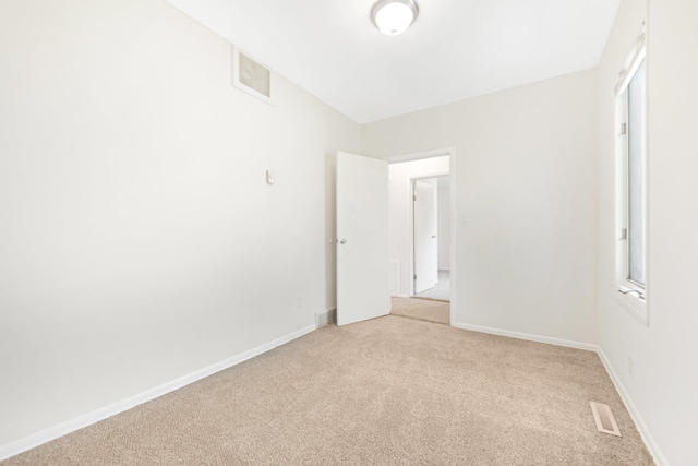 619 4th Ave E, Shakopee, MN 55379 - unfurnished room featuring light colored carpet and baseboards