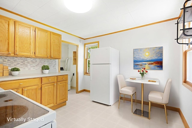 619 4th Ave E, Shakopee, MN 55379 - kitchen with white appliances, washer / dryer, backsplash, crown molding, and light countertops