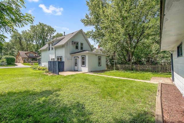 619 4th Ave E, Shakopee, MN 55379 - back of property featuring stucco siding and a patio area