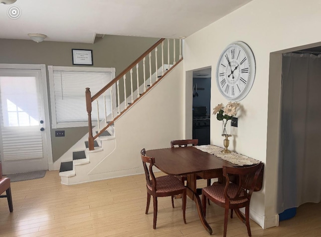 338 Jefferson St, Saint Croix Falls, WI 54024 - dining space with stairway and wood finished floors