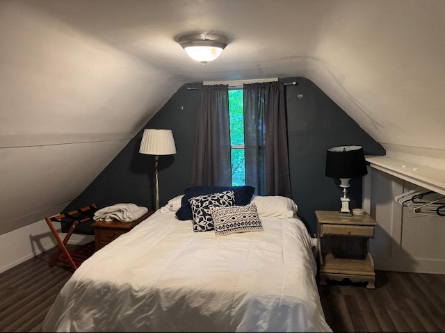 338 Jefferson St, Saint Croix Falls, WI 54024 - bedroom with wood finished floors and vaulted ceiling
