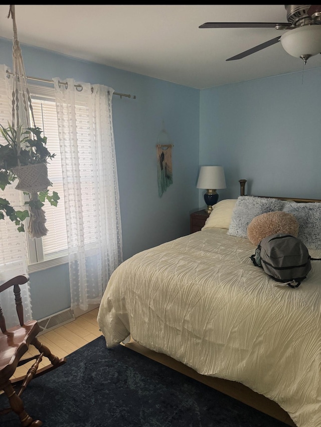 338 Jefferson St, Saint Croix Falls, WI 54024 - bedroom featuring wood finished floors and a ceiling fan