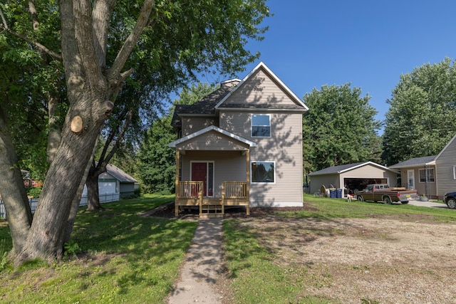 269 Chestnut St, Ellsworth, WI 54011 - view of front facade featuring a deck, a front lawn, a garage, and a chimney