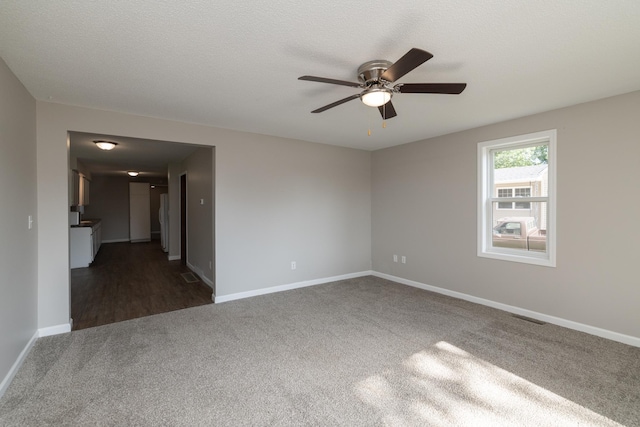 269 Chestnut St, Ellsworth, WI 54011 - carpeted empty room with a ceiling fan and baseboards