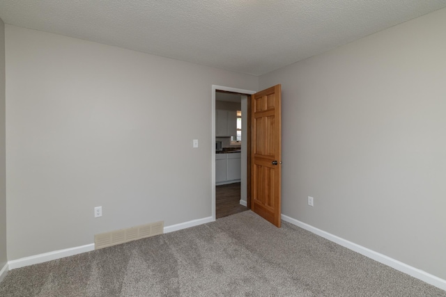 269 Chestnut St, Ellsworth, WI 54011 - empty room featuring carpet flooring and baseboards