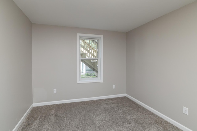 269 Chestnut St, Ellsworth, WI 54011 - carpeted empty room featuring baseboards