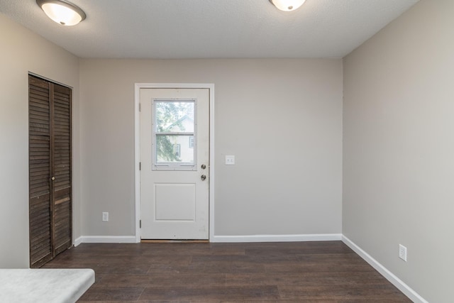 269 Chestnut St, Ellsworth, WI 54011 - entrance foyer with dark wood finished floors and baseboards