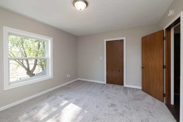 269 Chestnut St, Ellsworth, WI 54011 - unfurnished bedroom with carpet floors and baseboards
