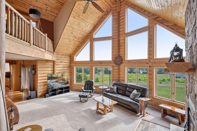 70824 227th St, Dassel Twp, MN 55325 - living area with high vaulted ceiling, rustic walls, ceiling fan, and wood ceiling