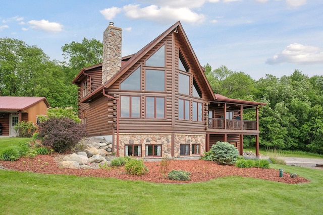 70824 227th St, Dassel Twp, MN 55325 - rear view of house featuring a lawn, a chimney, log siding, and a balcony