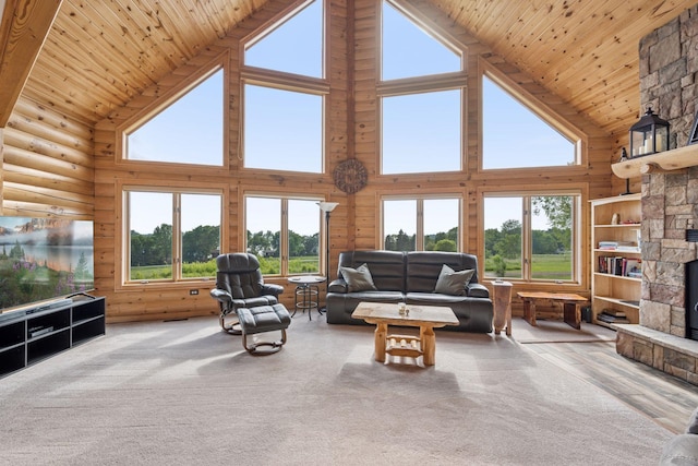 70824 227th St, Dassel Twp, MN 55325 - living area featuring high vaulted ceiling, wood ceiling, rustic walls, and a fireplace
