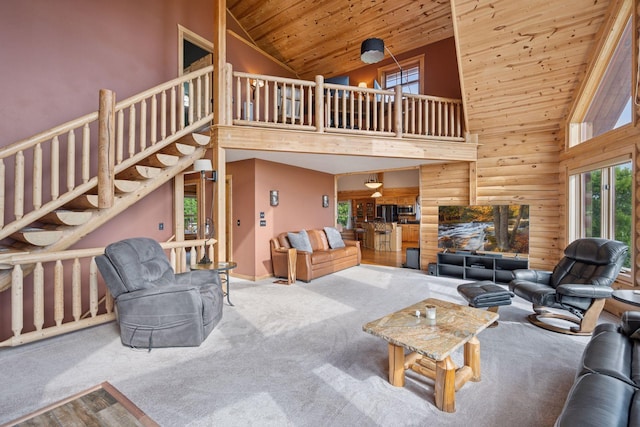 70824 227th St, Dassel Twp, MN 55325 - carpeted living area with wooden ceiling, high vaulted ceiling, stairs, and log walls