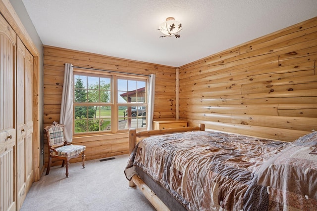 70824 227th St, Dassel Twp, MN 55325 - bedroom with light carpet and log walls