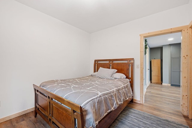 70824 227th St, Dassel Twp, MN 55325 - bedroom with wood finished floors and baseboards