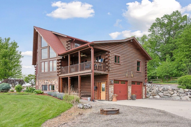 70824 227th St, Dassel Twp, MN 55325 - log home with log siding, an attached garage, gravel driveway, a balcony, and a ceiling fan