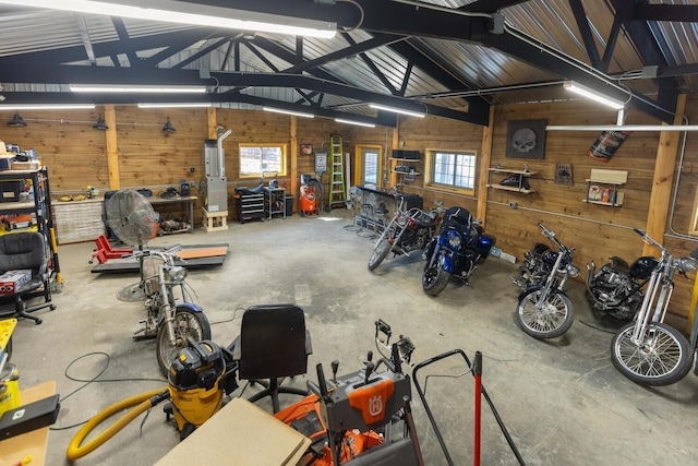 70824 227th St, Dassel Twp, MN 55325 - garage with wooden walls and a workshop area