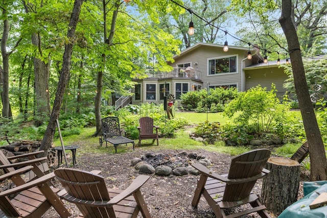 520 Wedgewood Ln N, Plymouth, MN 55441 - back of house featuring an outdoor fire pit and a balcony