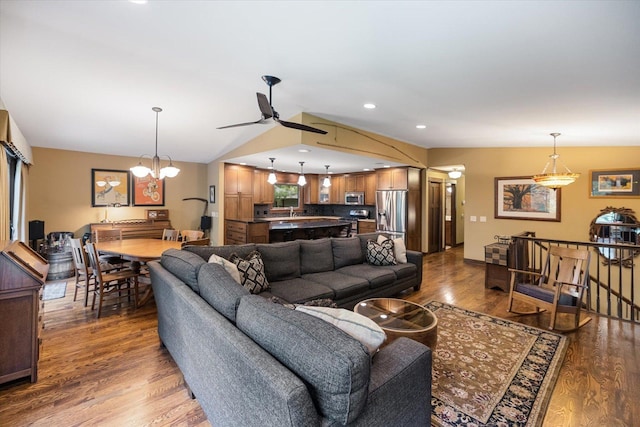 520 Wedgewood Ln N, Plymouth, MN 55441 - living area with ceiling fan, wood finished floors, vaulted ceiling, and a chandelier