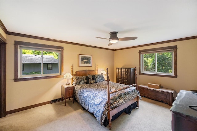 520 Wedgewood Ln N, Plymouth, MN 55441 - bedroom featuring light colored carpet, multiple windows, ornamental molding, and a ceiling fan