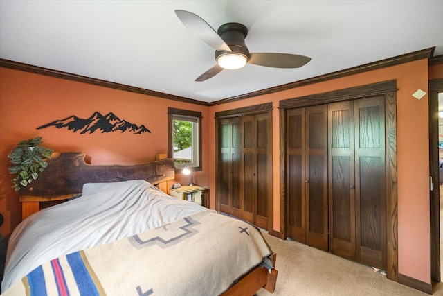 520 Wedgewood Ln N, Plymouth, MN 55441 - carpeted bedroom featuring ornamental molding, multiple closets, and a ceiling fan