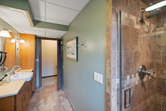 520 Wedgewood Ln N, Plymouth, MN 55441 - bathroom featuring vanity, a shower stall, stone finish floors, and a paneled ceiling
