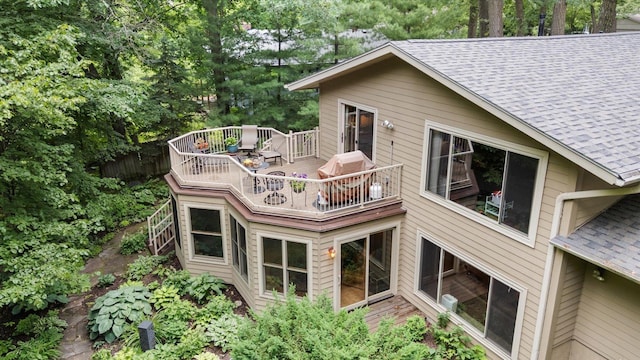 520 Wedgewood Ln N, Plymouth, MN 55441 - back of property featuring roof with shingles, a wooden deck, and a balcony