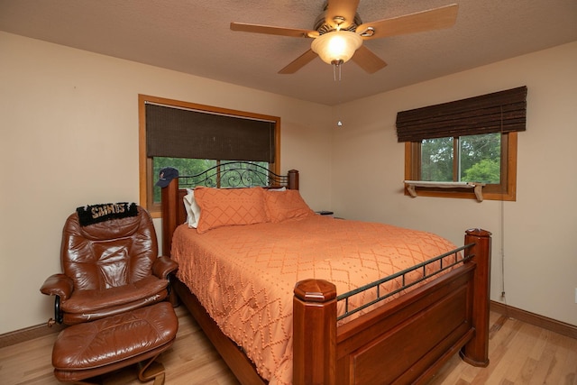 175 6th Ln NE, Oronoco, MN 55960 - bedroom featuring light wood finished floors and ceiling fan