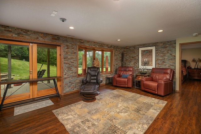 175 6th Ln NE, Oronoco, MN 55960 - living room with dark wood-type flooring, a textured ceiling, and recessed lighting
