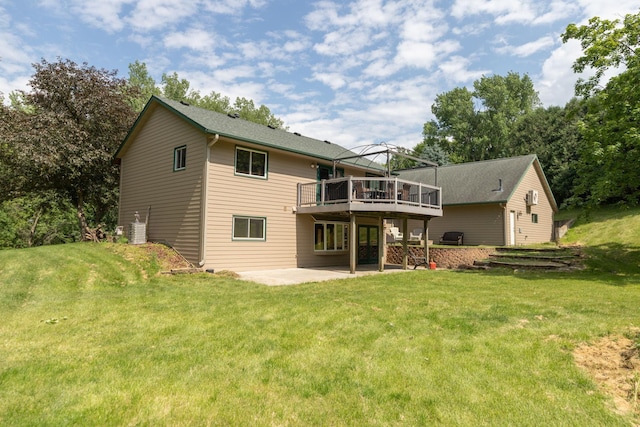 175 6th Ln NE, Oronoco, MN 55960 - rear view of house featuring a patio area, a wooden deck, and a lawn