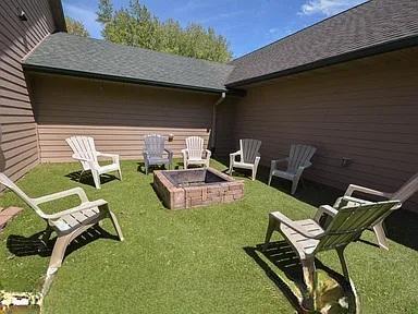 175 6th Ln NE, Oronoco, MN 55960 - view of green lawn featuring an outdoor fire pit
