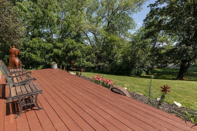 175 6th Ln NE, Oronoco, MN 55960 - wooden deck featuring a lawn and view of wooded area