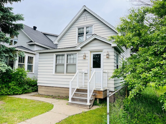 223 4th St, Virginia, MN 55792 - view of front facade featuring a shingled roof