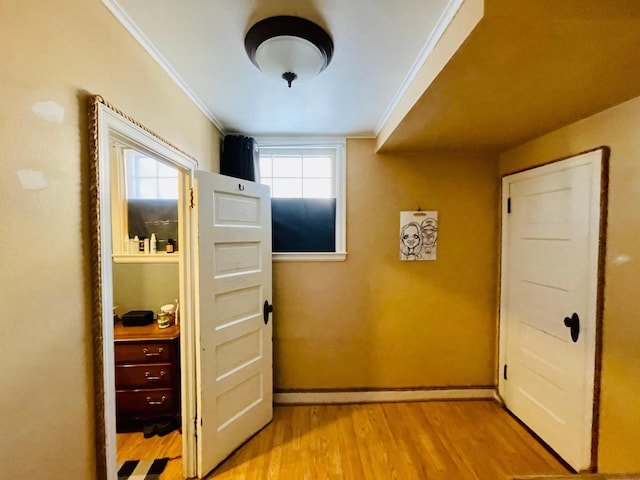 223 4th St, Virginia, MN 55792 - hallway featuring light wood-style flooring and crown molding