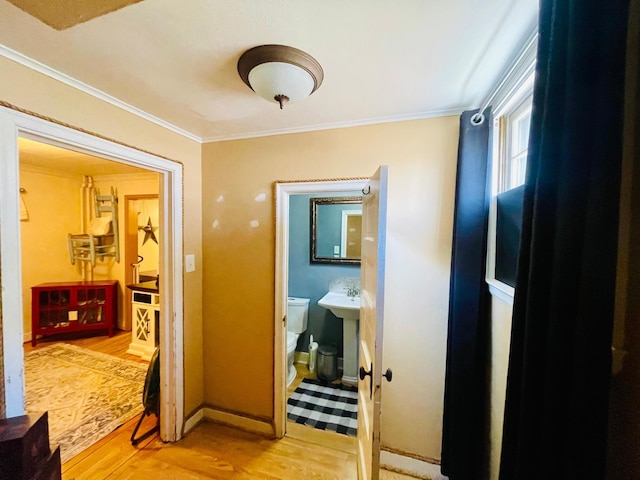 223 4th St, Virginia, MN 55792 - corridor with light wood-style floors and crown molding