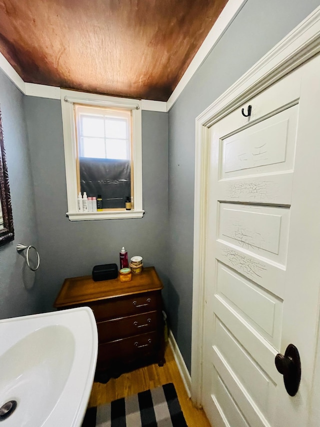 223 4th St, Virginia, MN 55792 - bathroom featuring wood finished floors and wooden ceiling