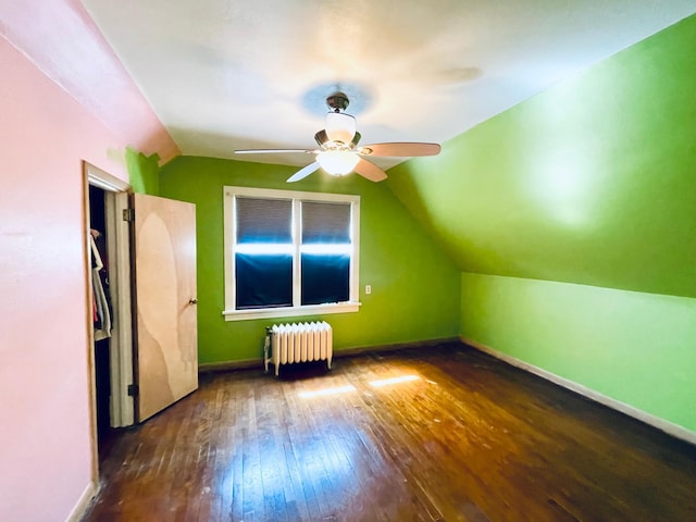 223 4th St, Virginia, MN 55792 - additional living space with radiator, hardwood / wood-style floors, lofted ceiling, and ceiling fan