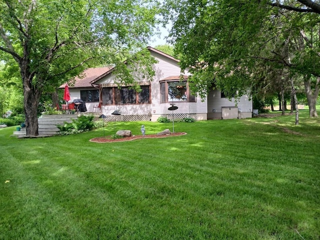 11160 Ottertail Point Dr NW, Cass Lake, MN 56633 - view of grassy yard featuring a sunroom