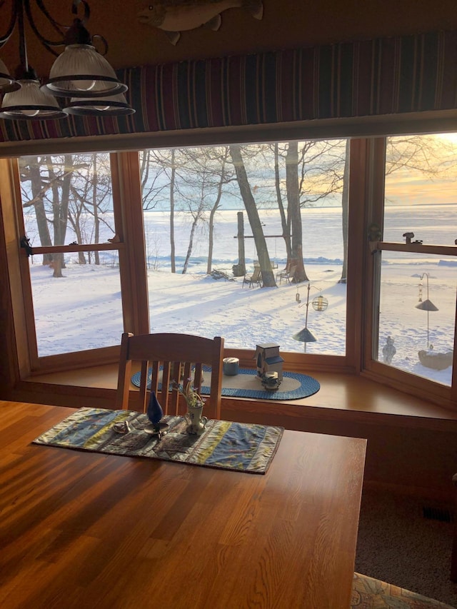 11160 Ottertail Point Dr NW, Cass Lake, MN 56633 - dining area featuring wood finished floors and a water view