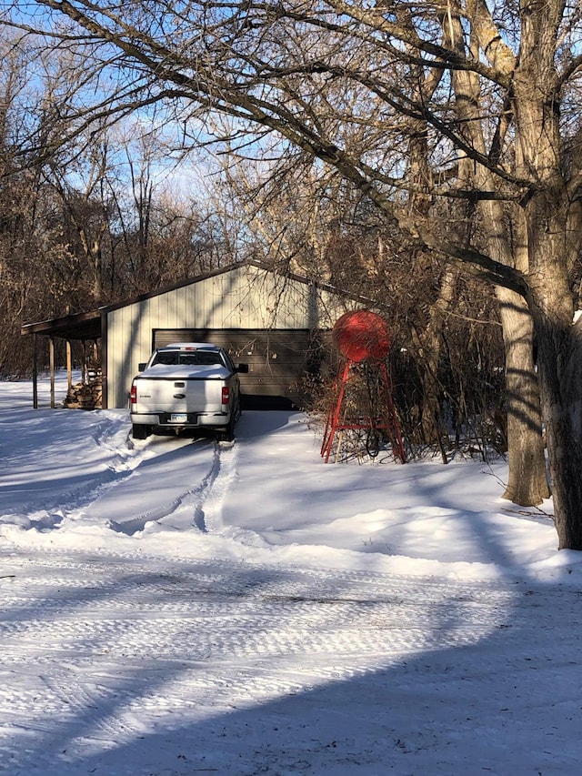 11160 Ottertail Point Dr NW, Cass Lake, MN 56633 - view of snow covered exterior featuring a garage