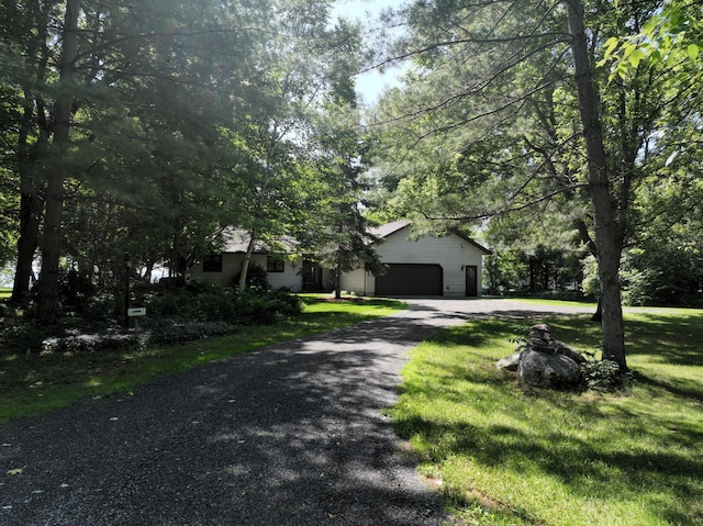 11160 Ottertail Point Dr NW, Cass Lake, MN 56633 - obstructed view of property with driveway, a garage, and a front yard