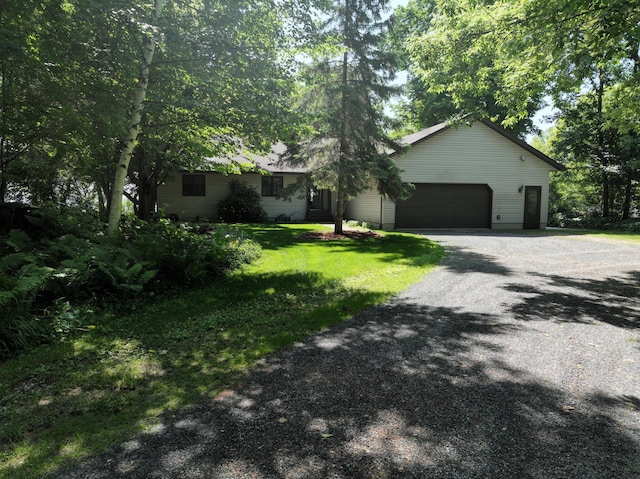 11160 Ottertail Point Dr NW, Cass Lake, MN 56633 - ranch-style home with gravel driveway, an attached garage, and a front lawn