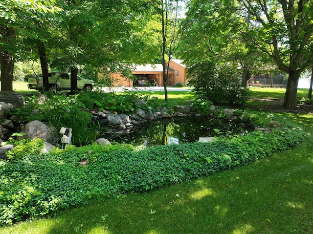 11160 Ottertail Point Dr NW, Cass Lake, MN 56633 - view of green lawn featuring a small pond