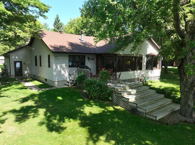 11160 Ottertail Point Dr NW, Cass Lake, MN 56633 - rear view of house featuring a shingled roof, a yard, and a sunroom