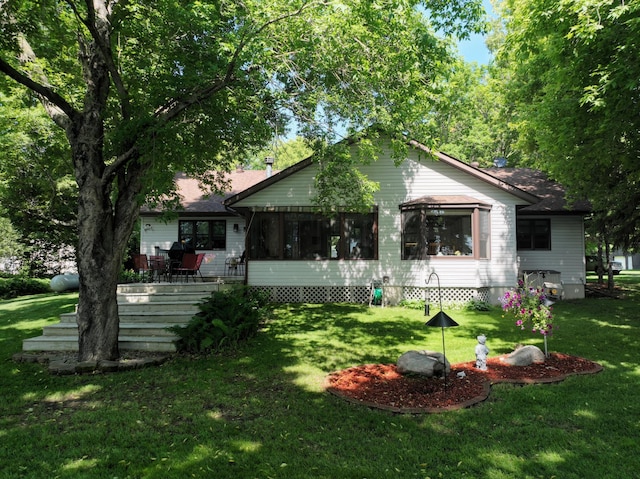 11160 Ottertail Point Dr NW, Cass Lake, MN 56633 - view of front of property featuring a front lawn and a sunroom