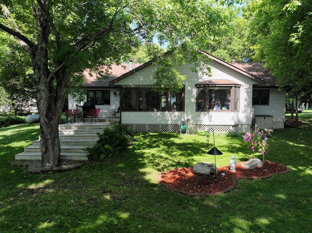 11160 Ottertail Point Dr NW, Cass Lake, MN 56633 - rear view of house featuring a lawn and a deck