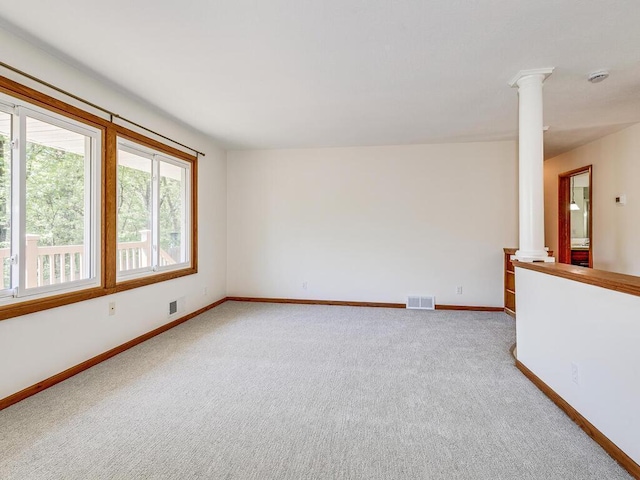 7651 86th St, Bloomington, MN 55438 - carpeted spare room with decorative columns