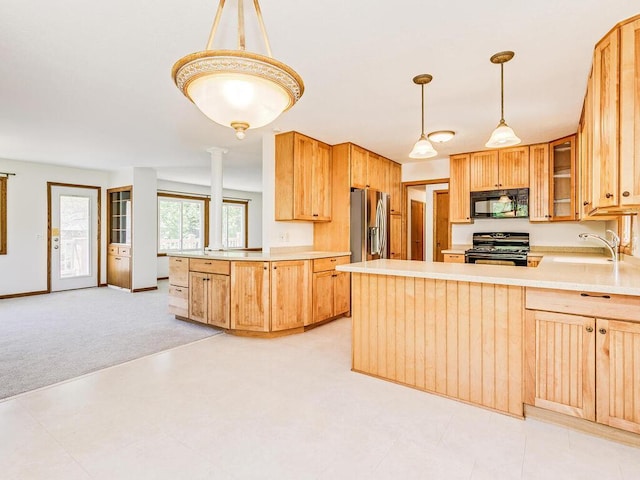 7651 86th St, Bloomington, MN 55438 - kitchen with stainless steel appliances, a peninsula, light countertops, light colored carpet, and glass insert cabinets
